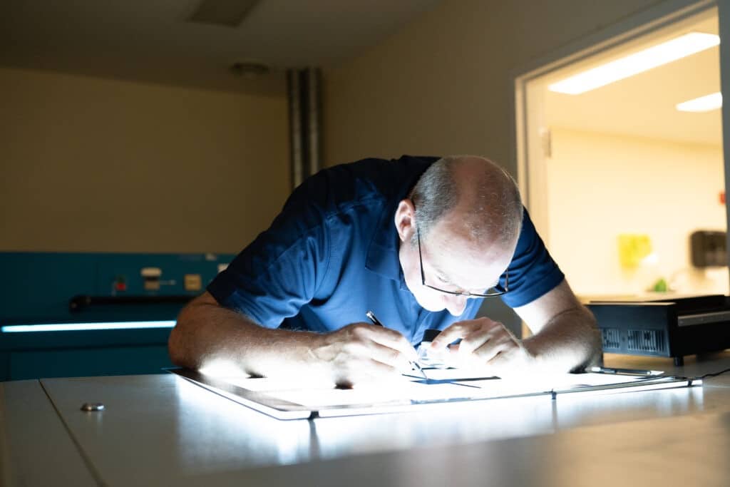 A worker working on a packaging system