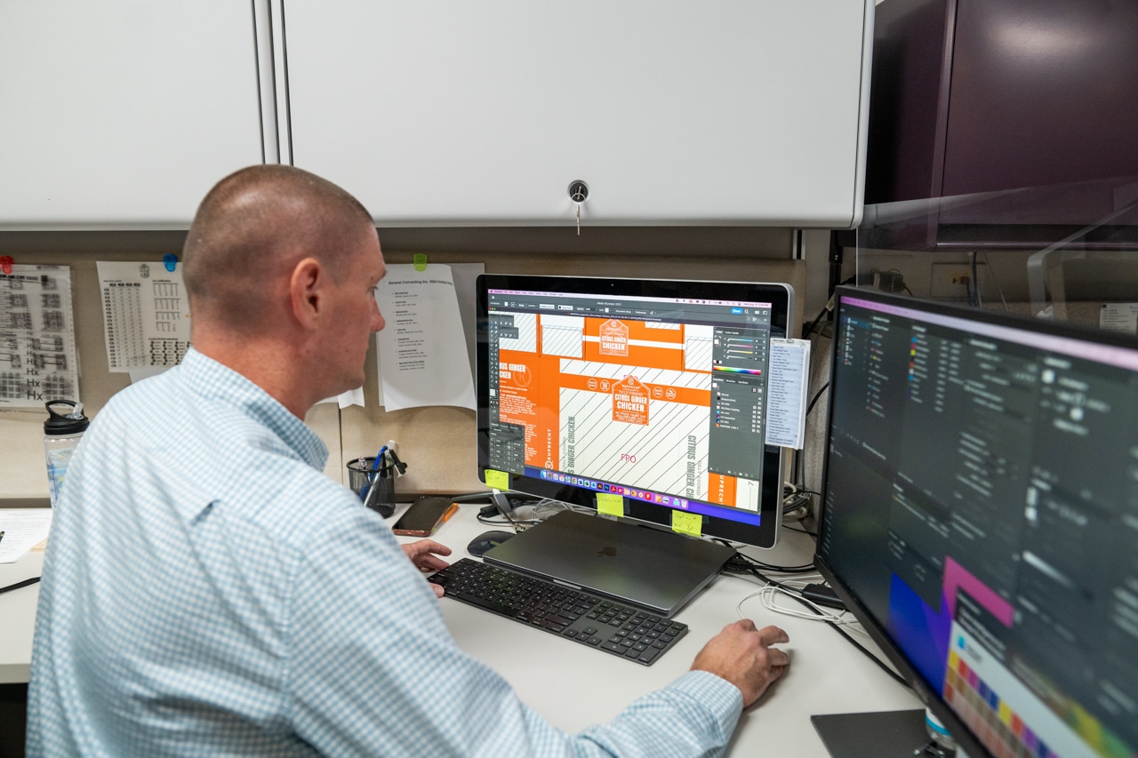 Worker designing in front of a computer